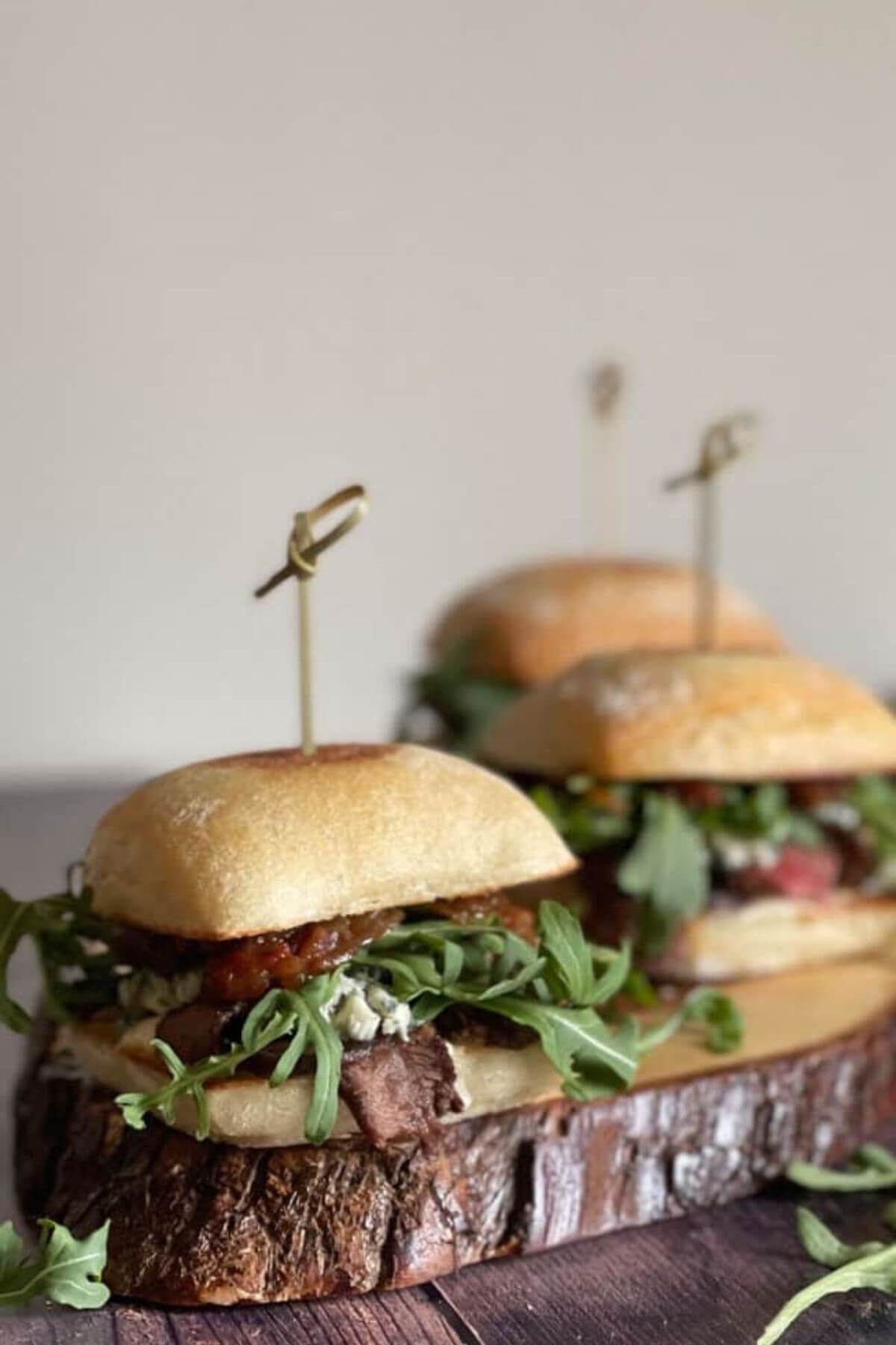 Steak and blue cheese sliders with horseradish.