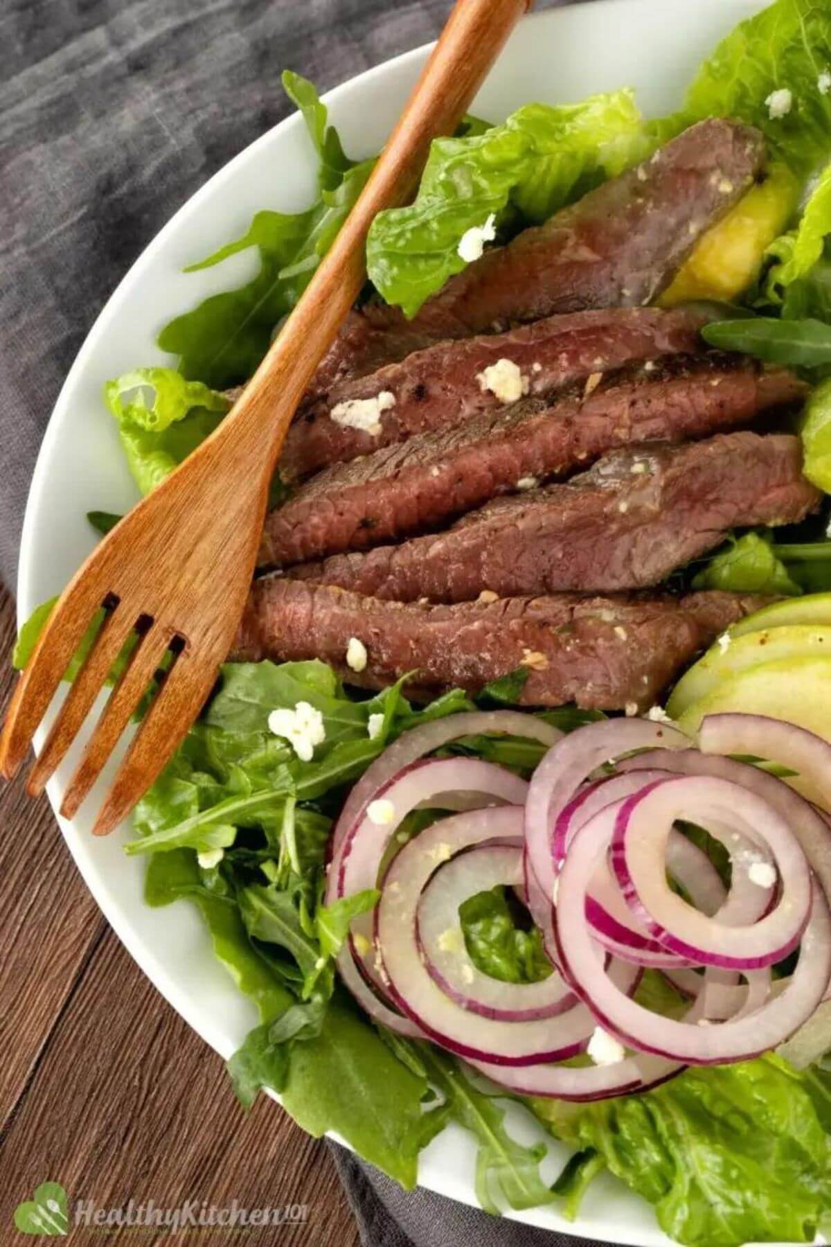 Steak salad using shaved steak for a delicious and healthy meal.