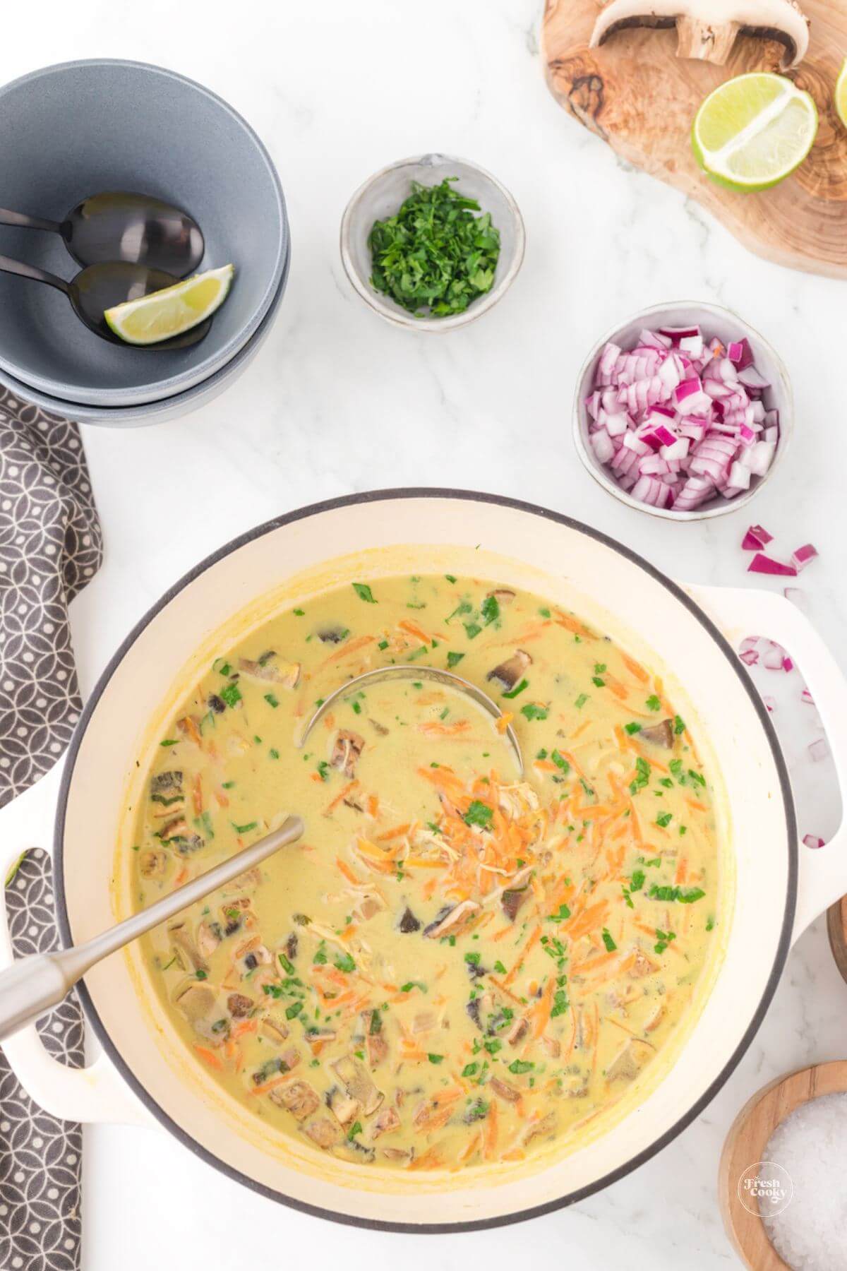 Pot of Tom kha soup, Thai chicken soup.