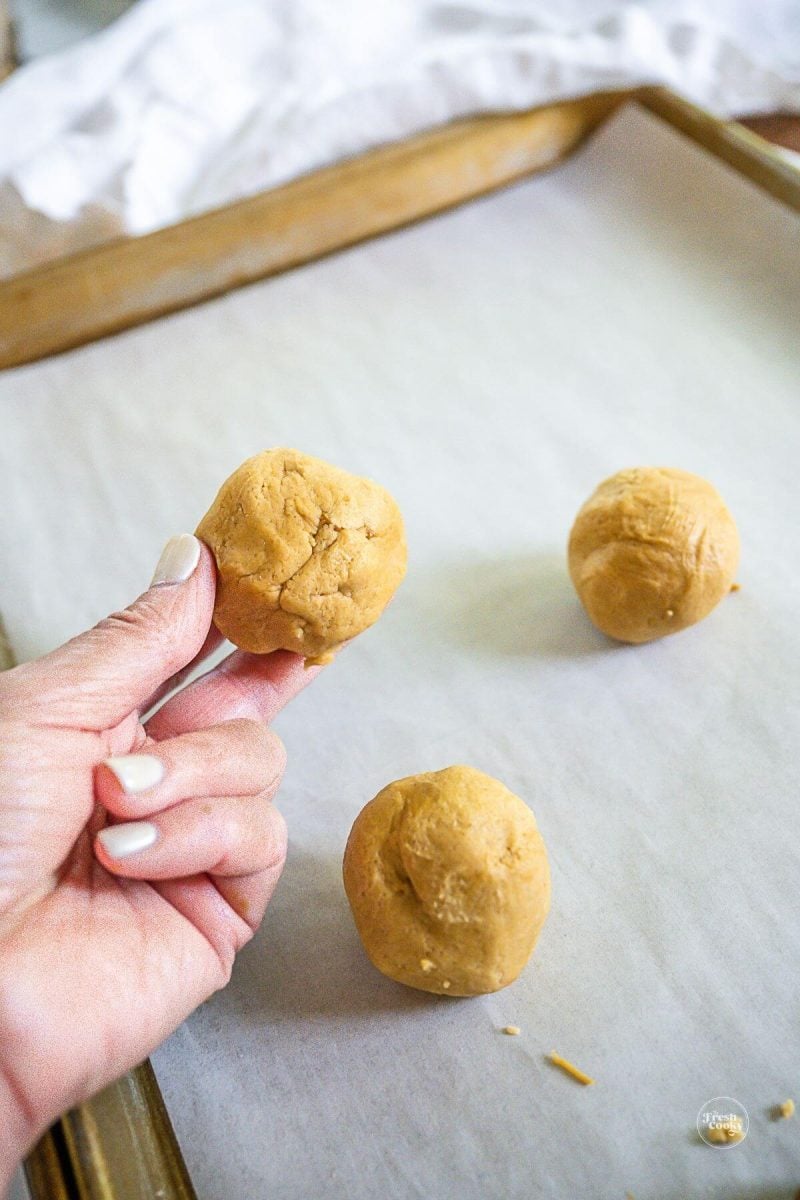 Wrap cookie dough sealing around the cookie butter ball. 