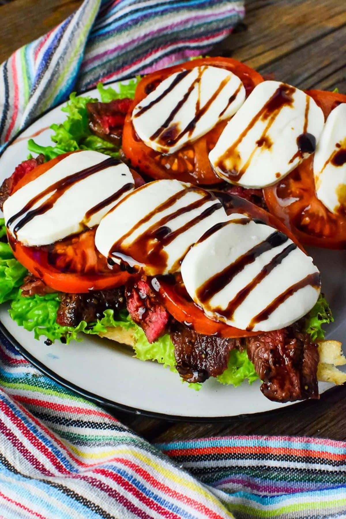 Open face caprese steak sandwiches.