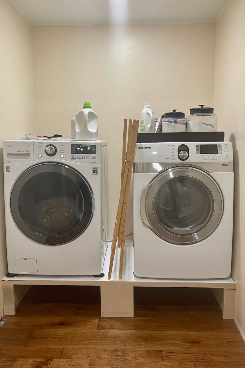 Washer and dryer on built-in riser.