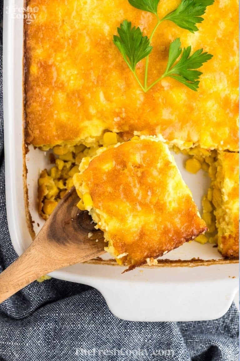 Serving a slice of corn pudding casserole for Pinterest pinning.