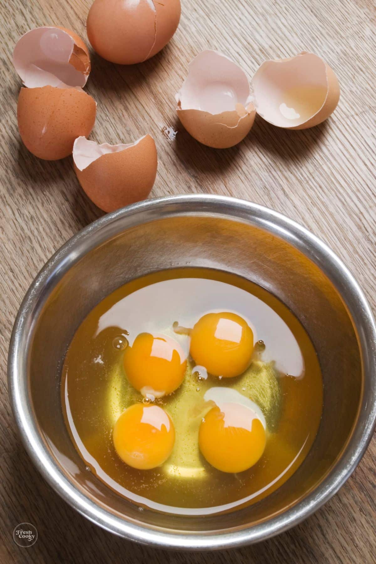 4 eggs cracked into a prep bowl.