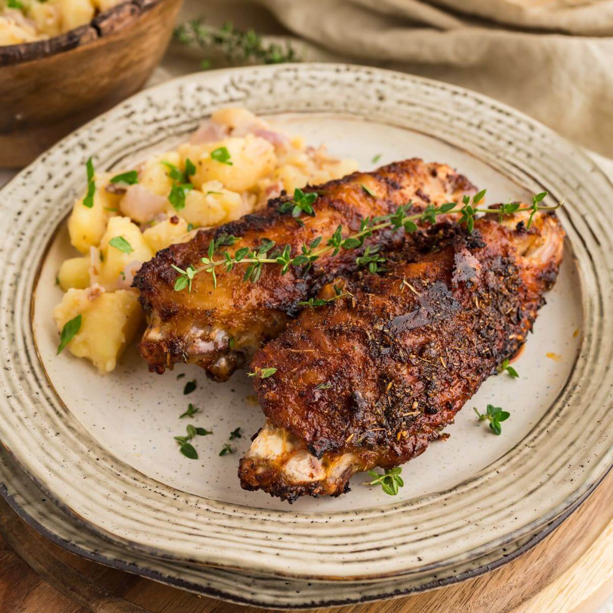 Air Fryer Turkey Wings on plate with a side.