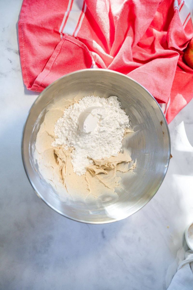 Powdered sugar mixed into cream cheese frosting.