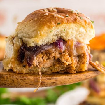 square image of BBQ Chicken Slider lifted up on a wooden spoon.