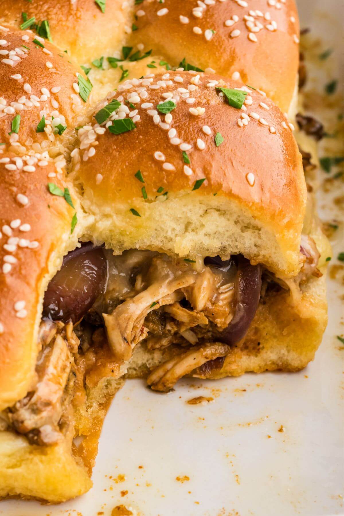 Barbecue Chicken Sliders showing filling inside of sandwich.