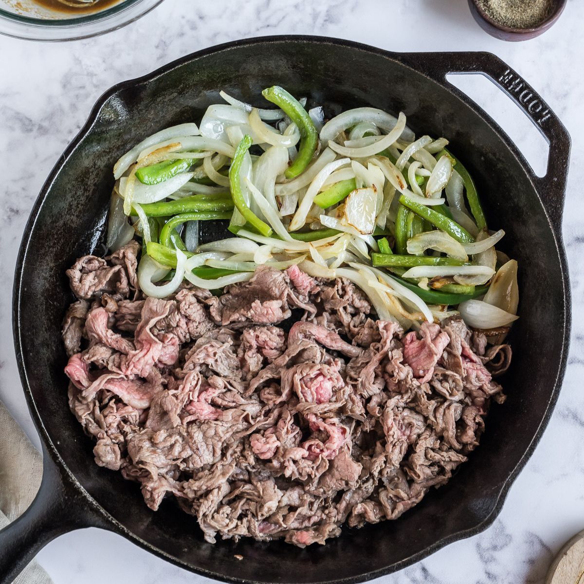 Add shaved steak to the pan and brown.