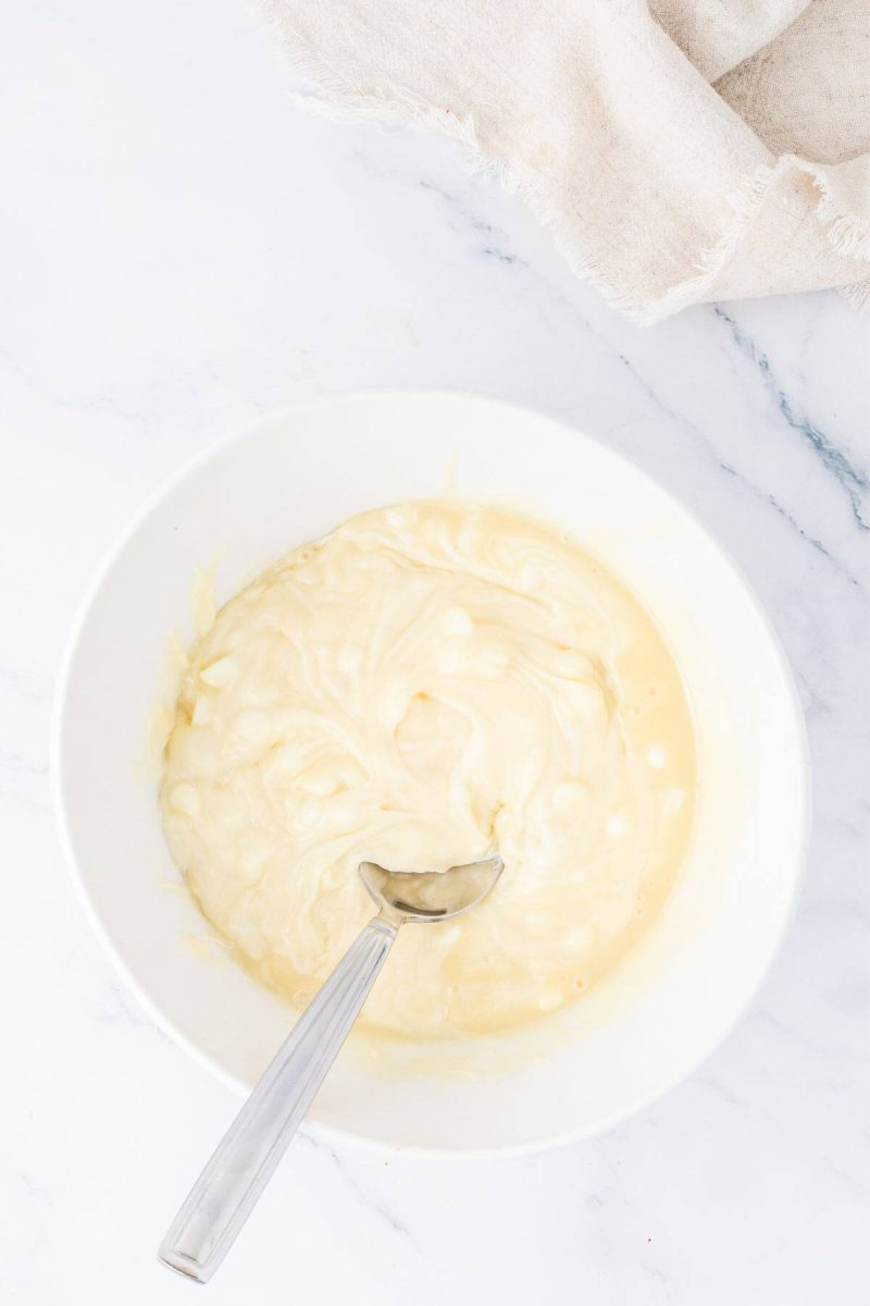 Melting white chocolate chips and sweetened condensed milk for fudge recipe. 