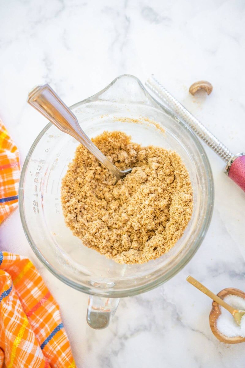 Mixing cinnamon crumb topping until moist and crumbly. 