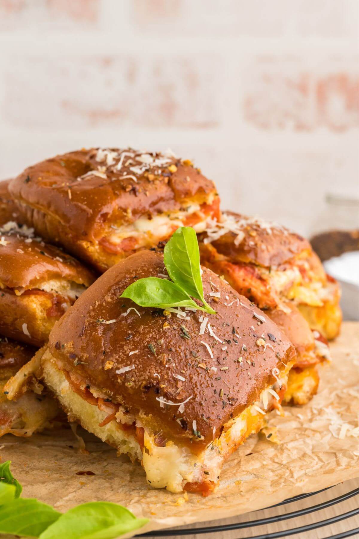 Pizza sliders with fresh basil.