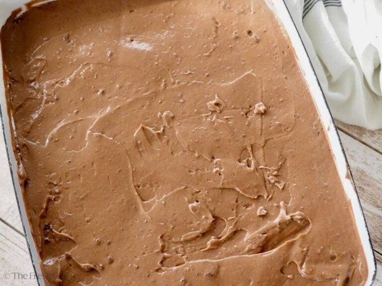 Smoothed chocolate pudding layer on Oreo dessert.