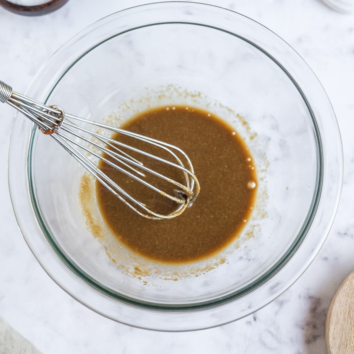 Steak seasoning sauce whisked together in bowl.