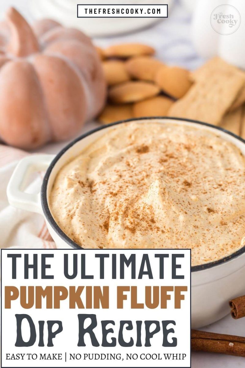 The ultimate easy to make Pumpkin Fluff Dip in a dish with pumpkin decor and cookies in background, to pin.