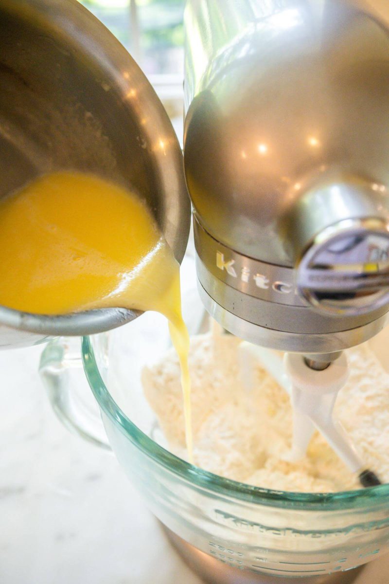 Slowly pour warm butter mixture into flour yeast mixture. 
