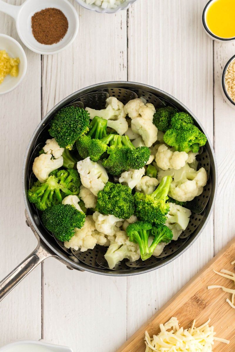 Broccoli cauliflower casserole recipe steaming the vegetables.