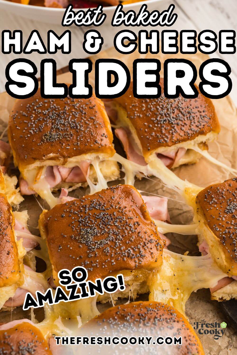 Gooey ham and cheese sliders being pulled away from each other with stringy gooey cheese pulls, to pin. 