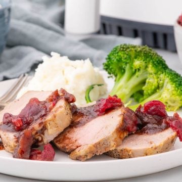 Marinated pork tenderloin with broccoli and mashed potatoes.