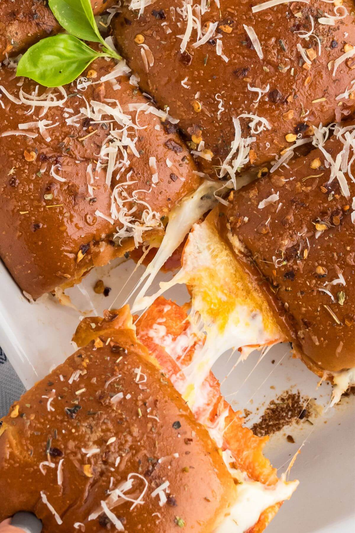 Stretchy cheese on gooey pizza slider recipe.