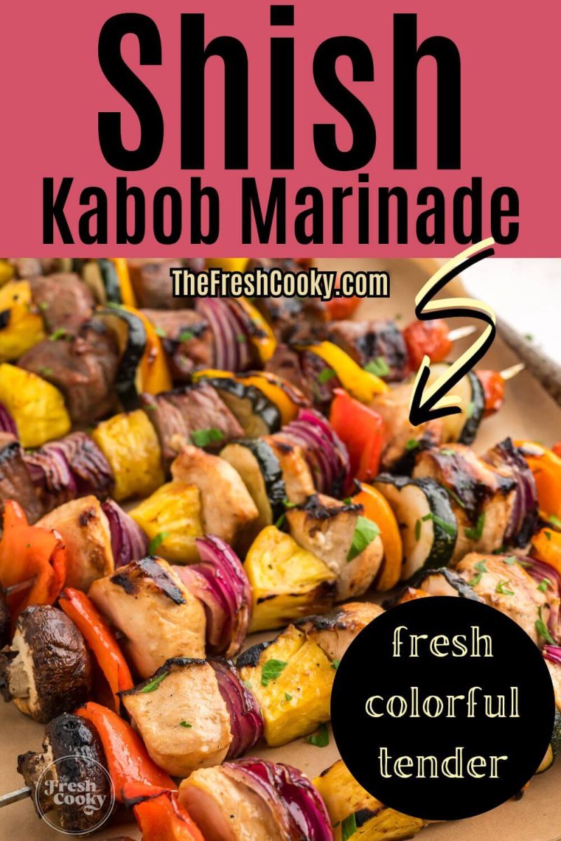 Close up view of full shish kabob skewers with colorful blend of veggies and marinated chicken and steak, to pin.