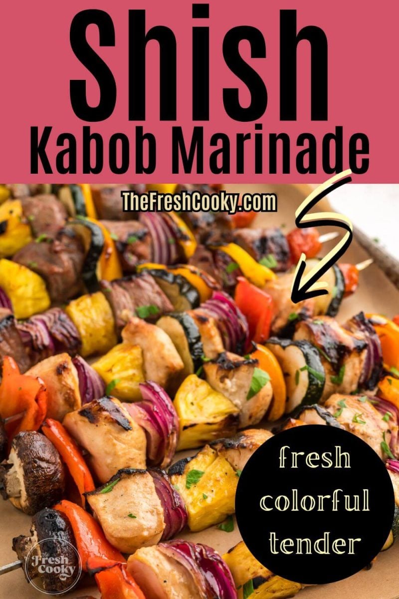 Close up view of full shish kabob skewers with colorful blend of veggies and marinated chicken and steak, to pin.