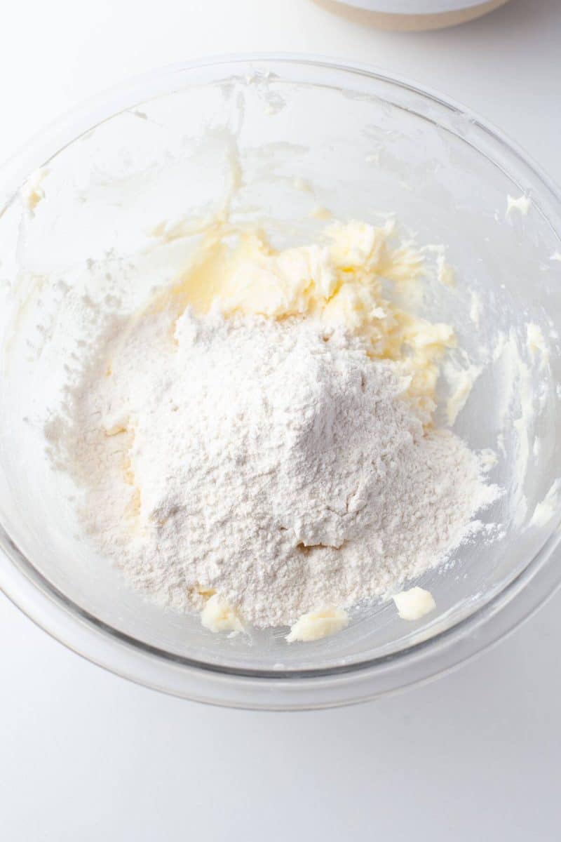 Butter and dry ingredients sit in mixing bowl.