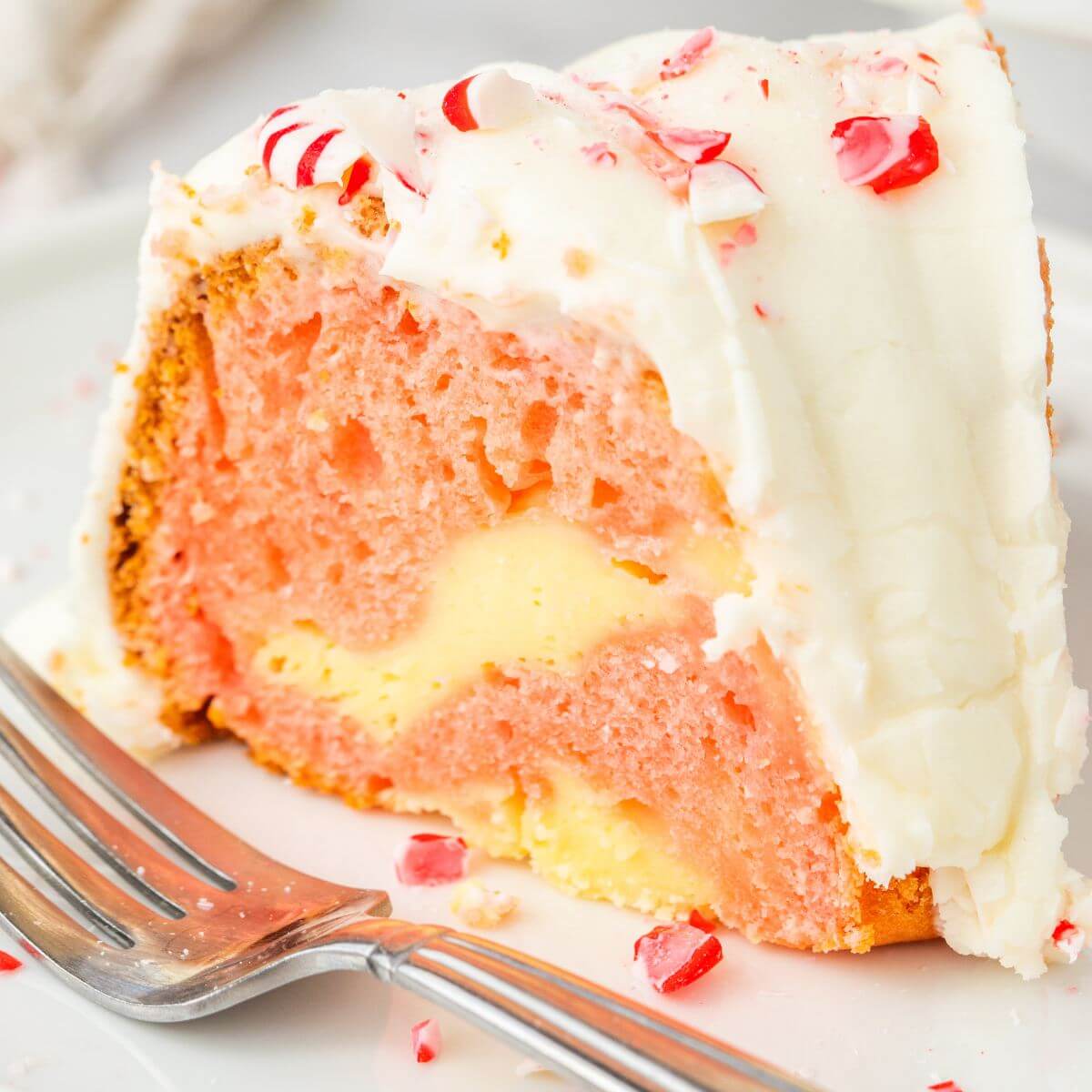 Slice of Peppermint Cake served on plate with fork.