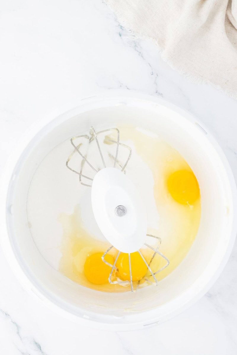 Beat eggs and sugar in mixer until light and fluffy.