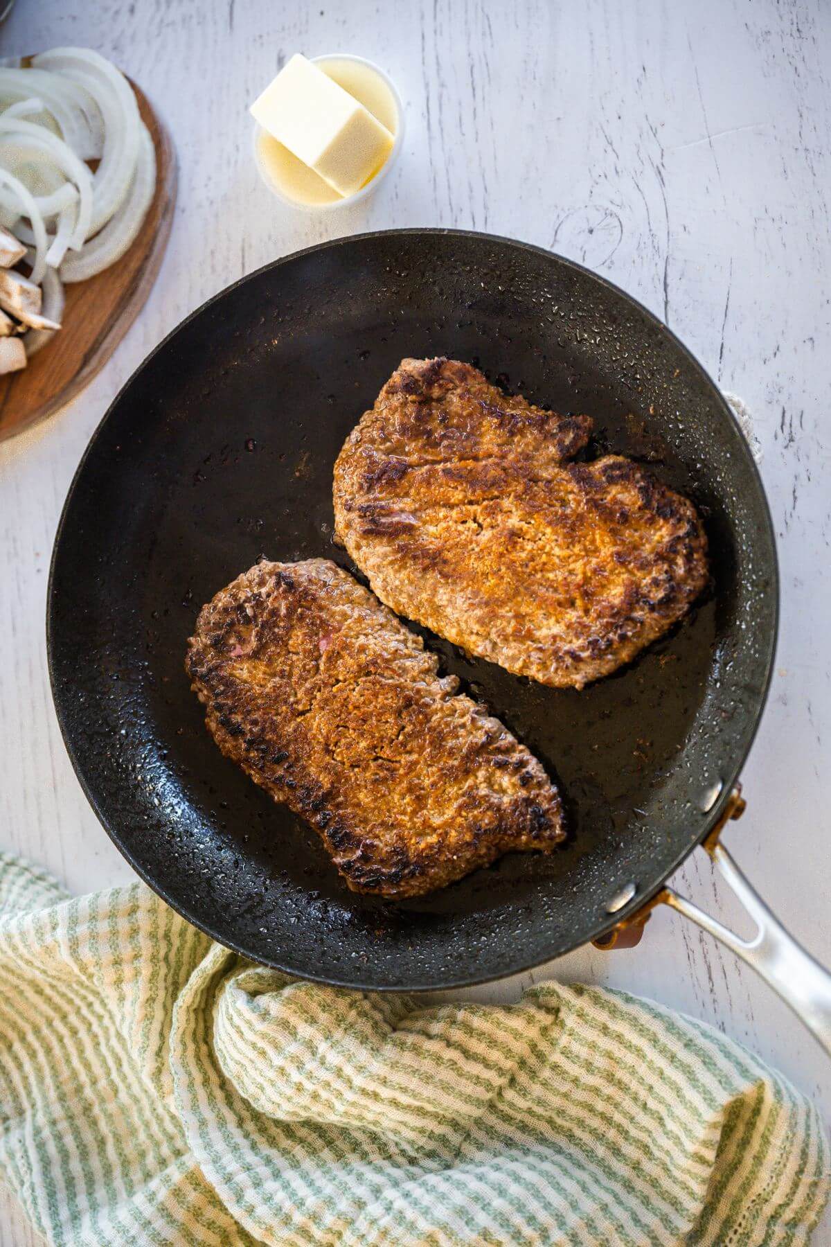 Cube steaks sizzle in skillet.