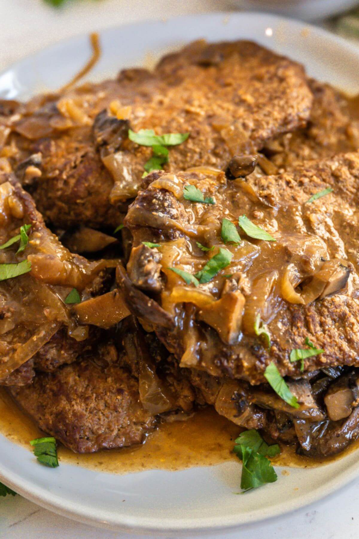 Close up view of Cube Steak and Gravy on plate.