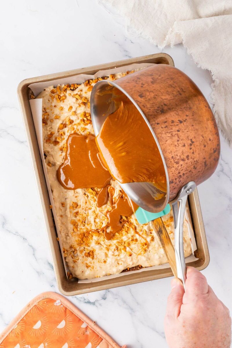 Pour caramel layer over the hardened nougat layer and freeze. 