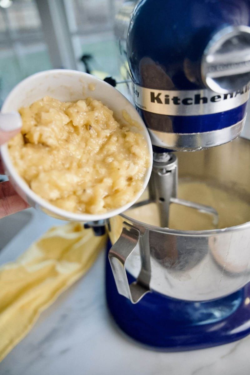 Adding mashed bananas to batter in kitchenaid mixer.
