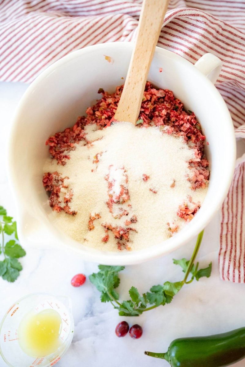 Pour in sugar into relish in bowl. 