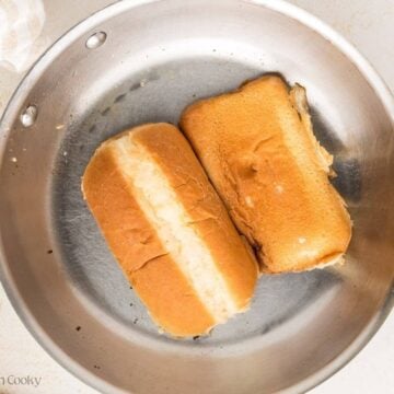 Toasting buns in a pan.