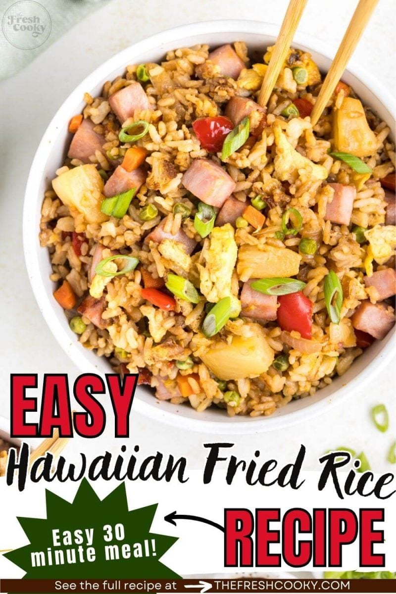 A bowl of fried rice with chopsticks rests on a table, to pin.