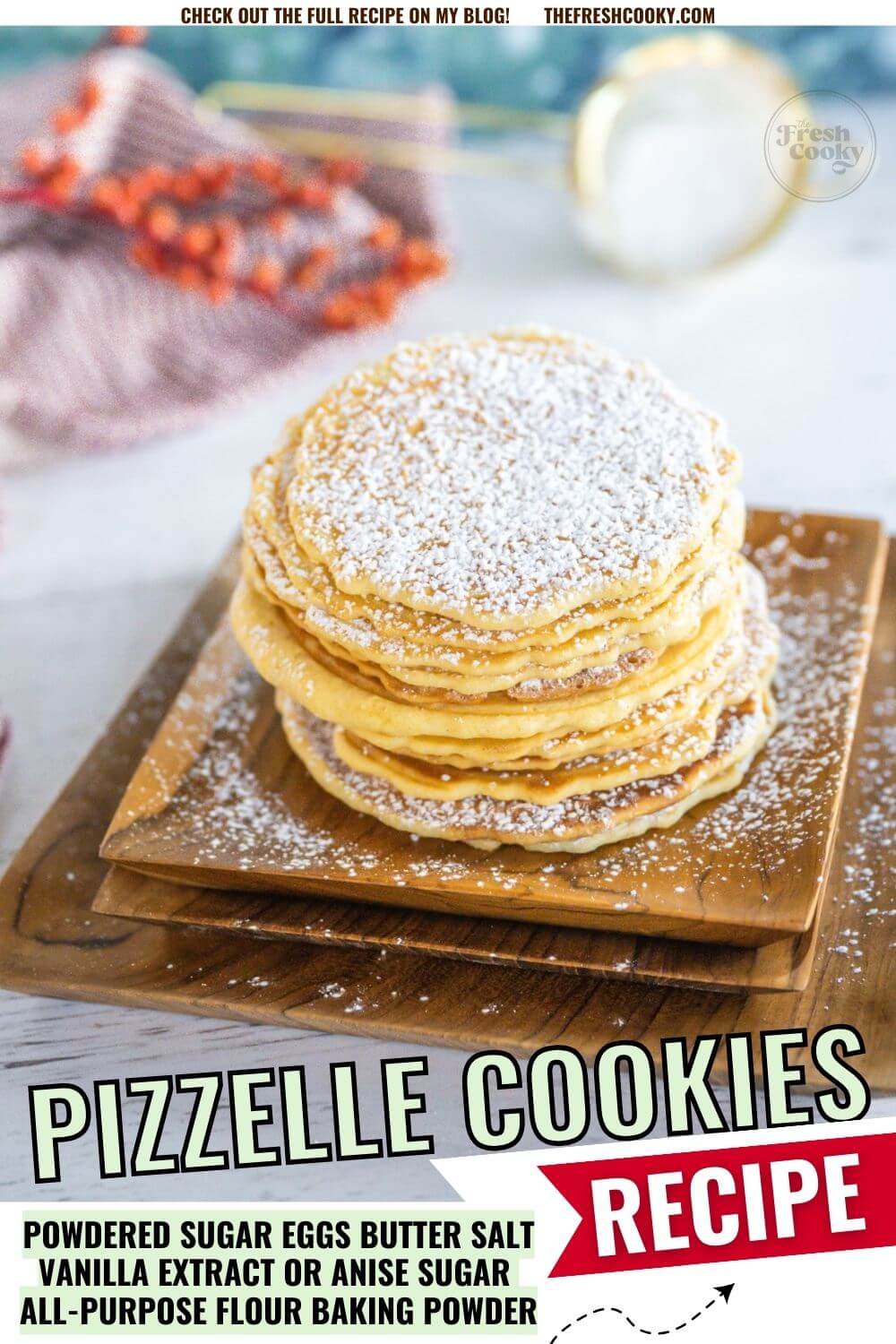 Pile of cookies are topped with powdered sugar near wintery decor, to pin.