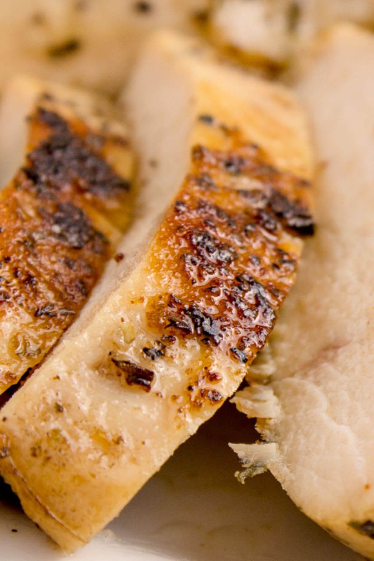 Blackened sear on the crust of chicken chunks is shown close up.