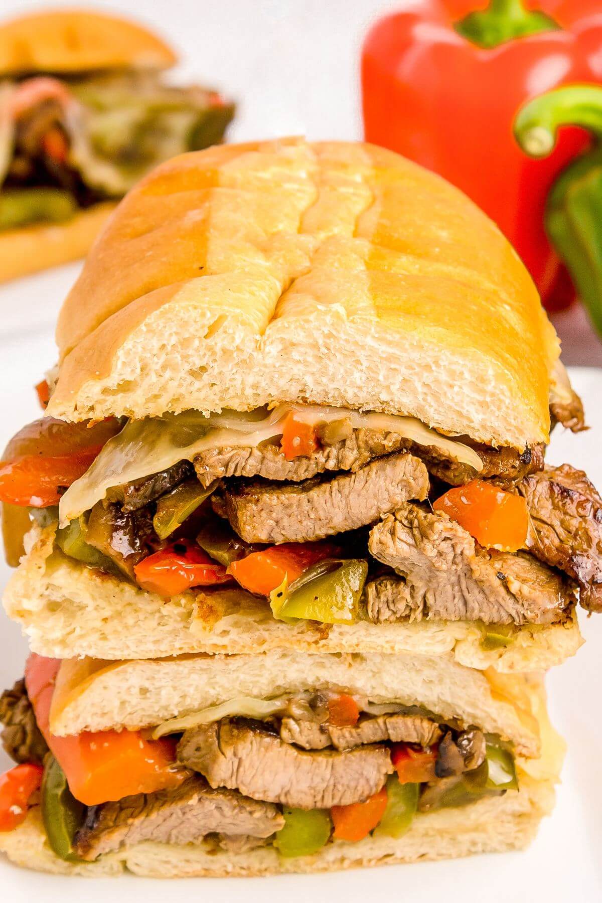 Sandwiches are stacked on each other to show all the fresh ingredients inside.
