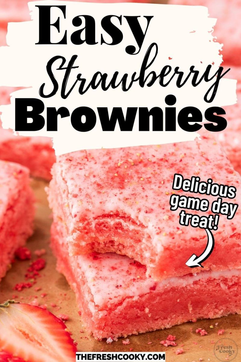 A stack of pink sprinkled brownies has a nibble taken from one, to pin.