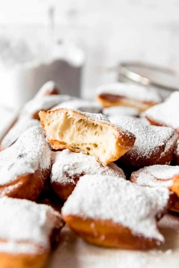Heavily powder sugared soft and pillowy beignets.
