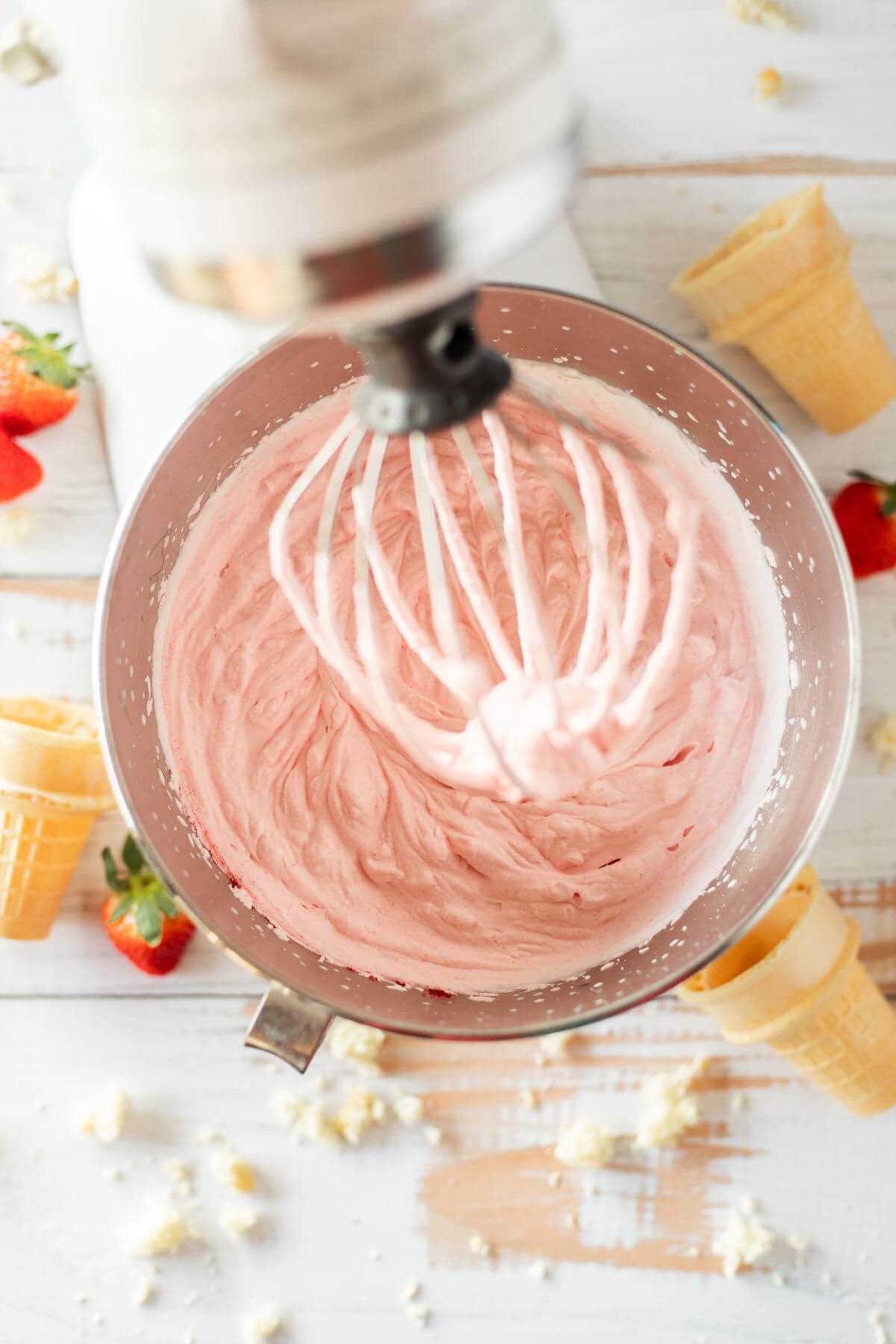 Pink mixture whipped in stand mixer for Strawberry shortcake ice cream. 