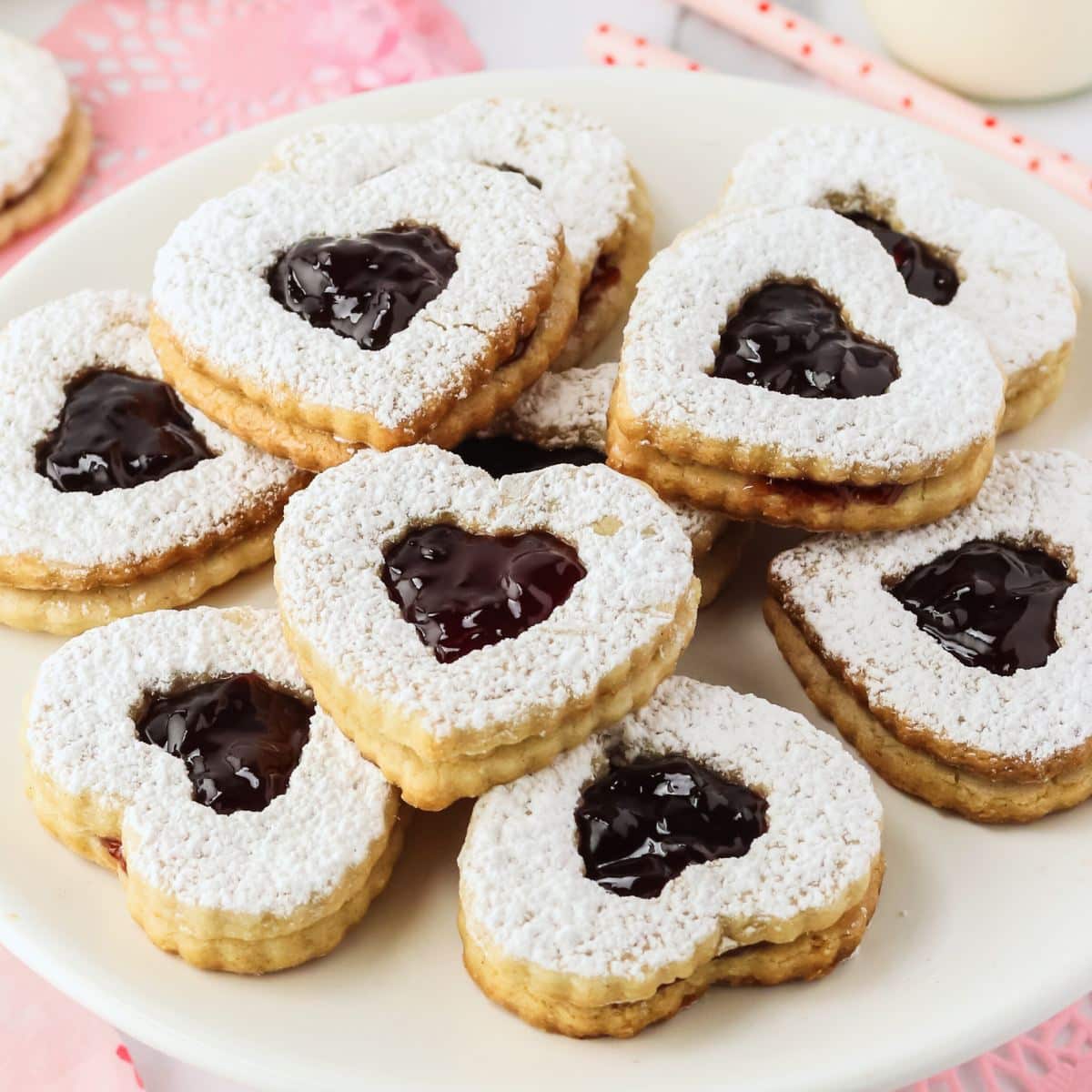 Raspberry Linzer Heart Cookies with peek-a-boo windows of raspberry jam.