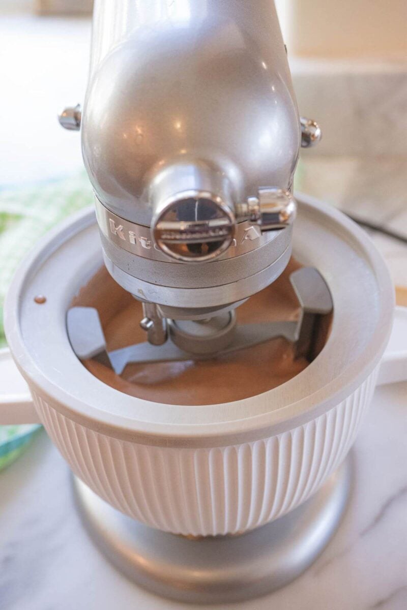 A KitchenAid ice cream machine churns the liquid base mixture.