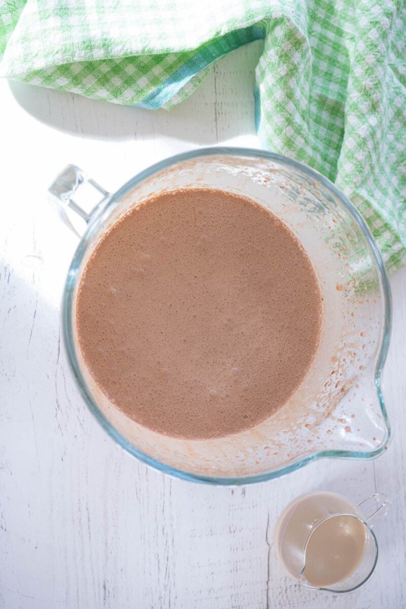 The mixed ice cream base is in a pitcher on table.