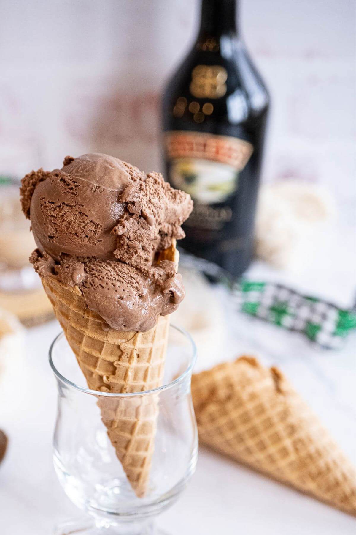 Two scoops of Baileys ice cream in a waffle cone. 