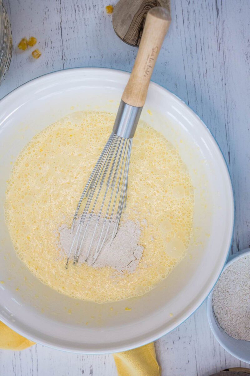 Whisk in dry ingredients into the wet for corn casserole in crockpot. 