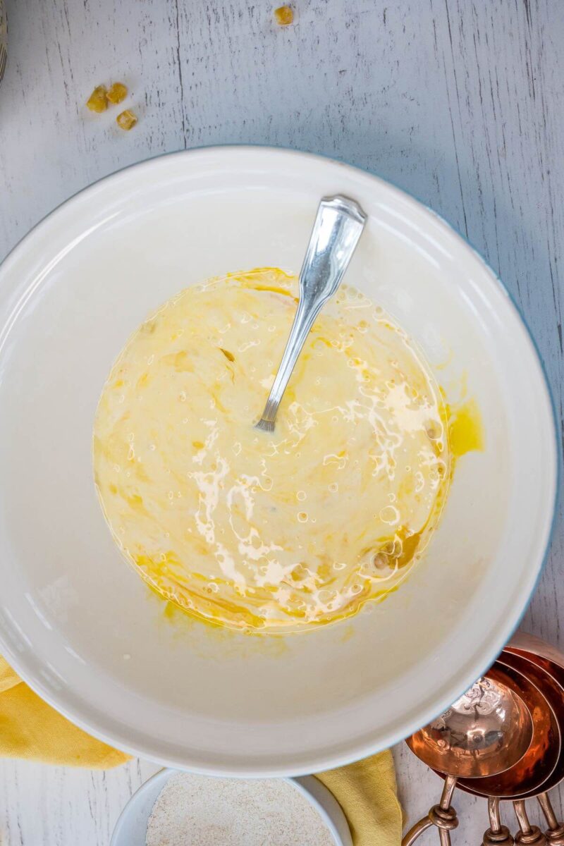 Adding heavy cream to beaten eggs.