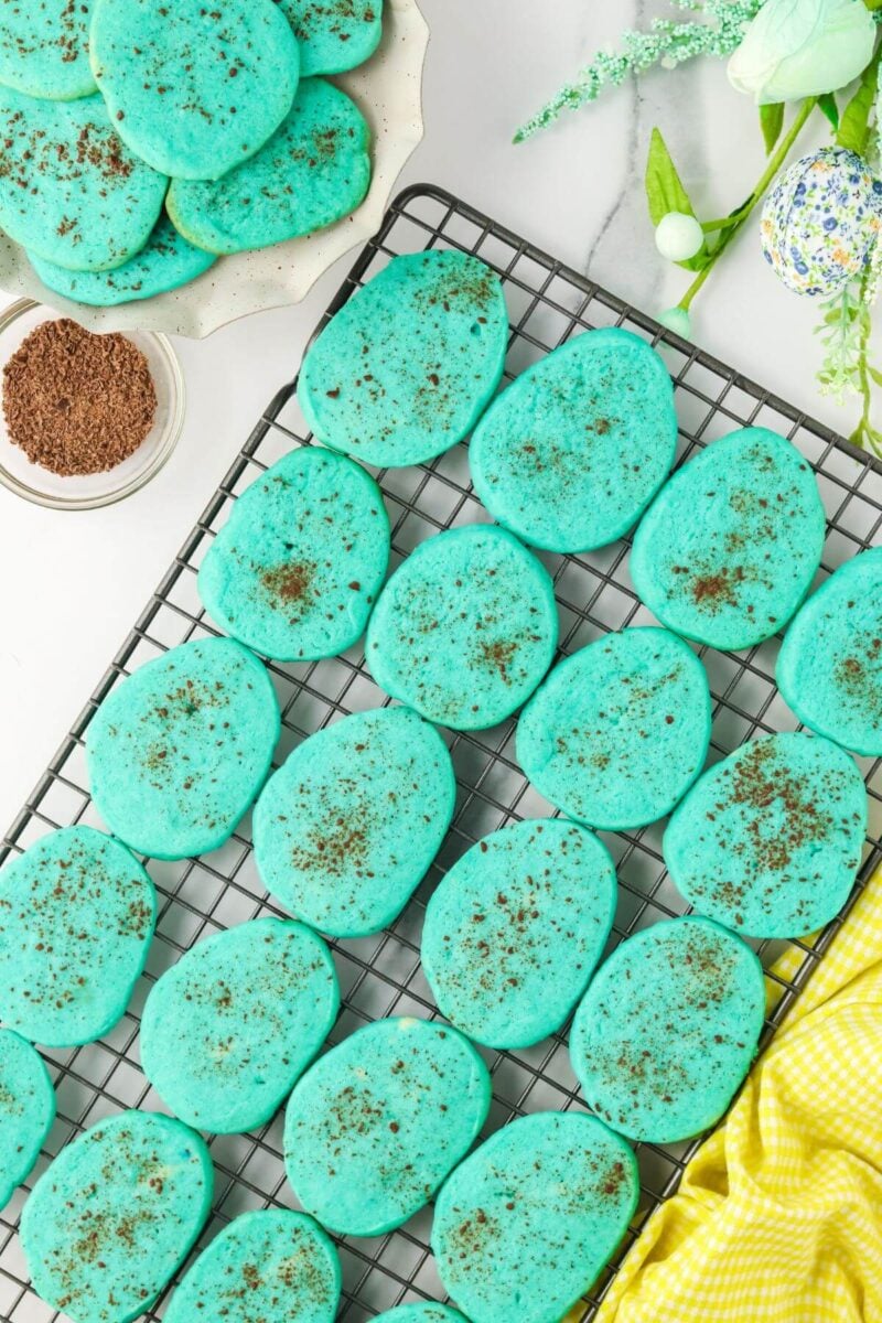 Easter egg cookies cooling on wire rack. 