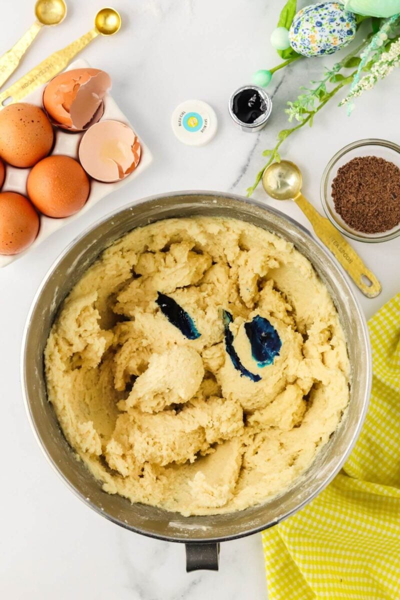 Add blue food gel coloring to the dough. 